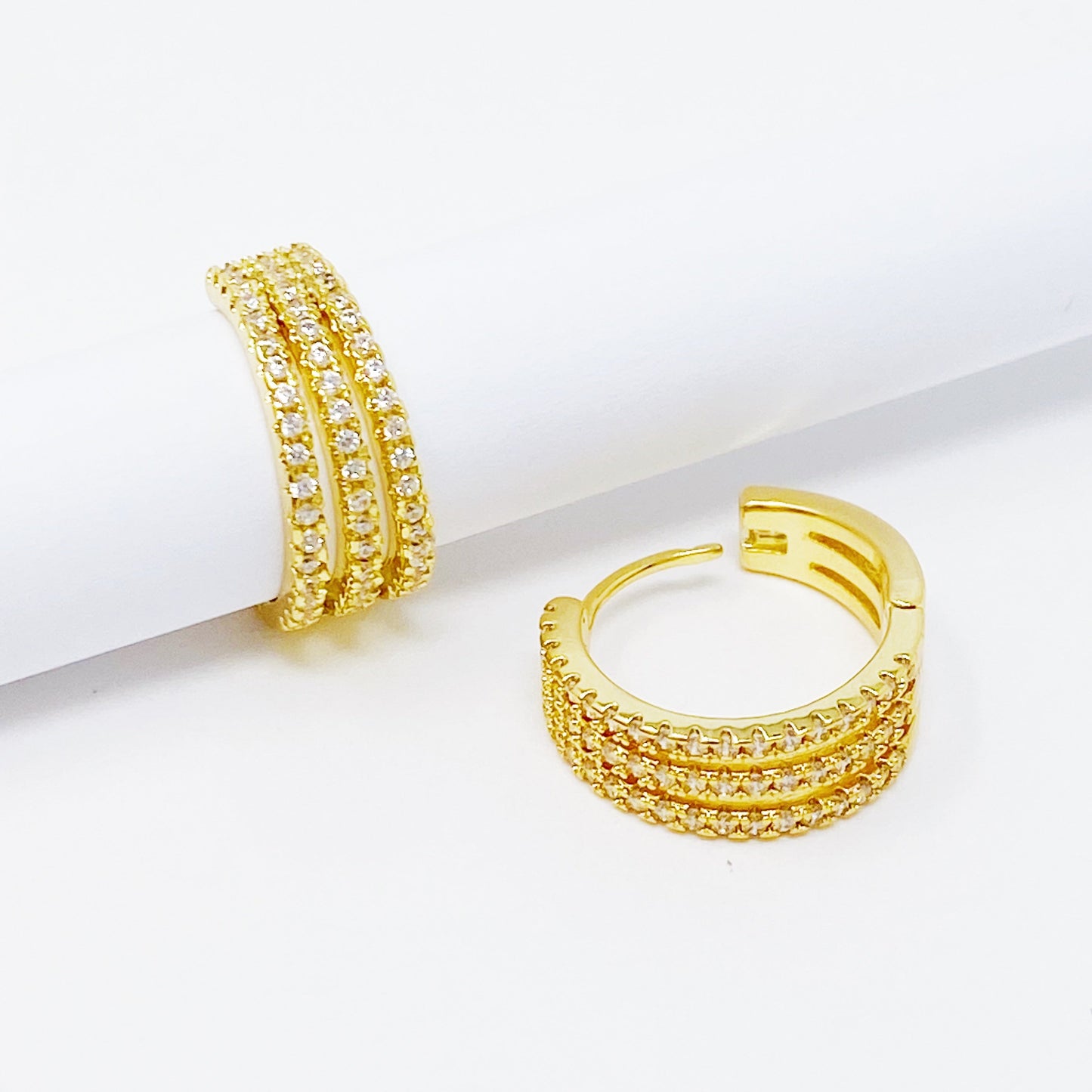 Triple Shine Huggie Earrings by Ellisonyoung.com
